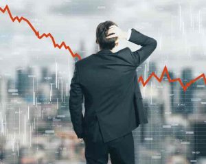 Back view of stressed young businessman looking at downward red arrow on blurry city background. Decrease, stats and economy concept. Multiexposure